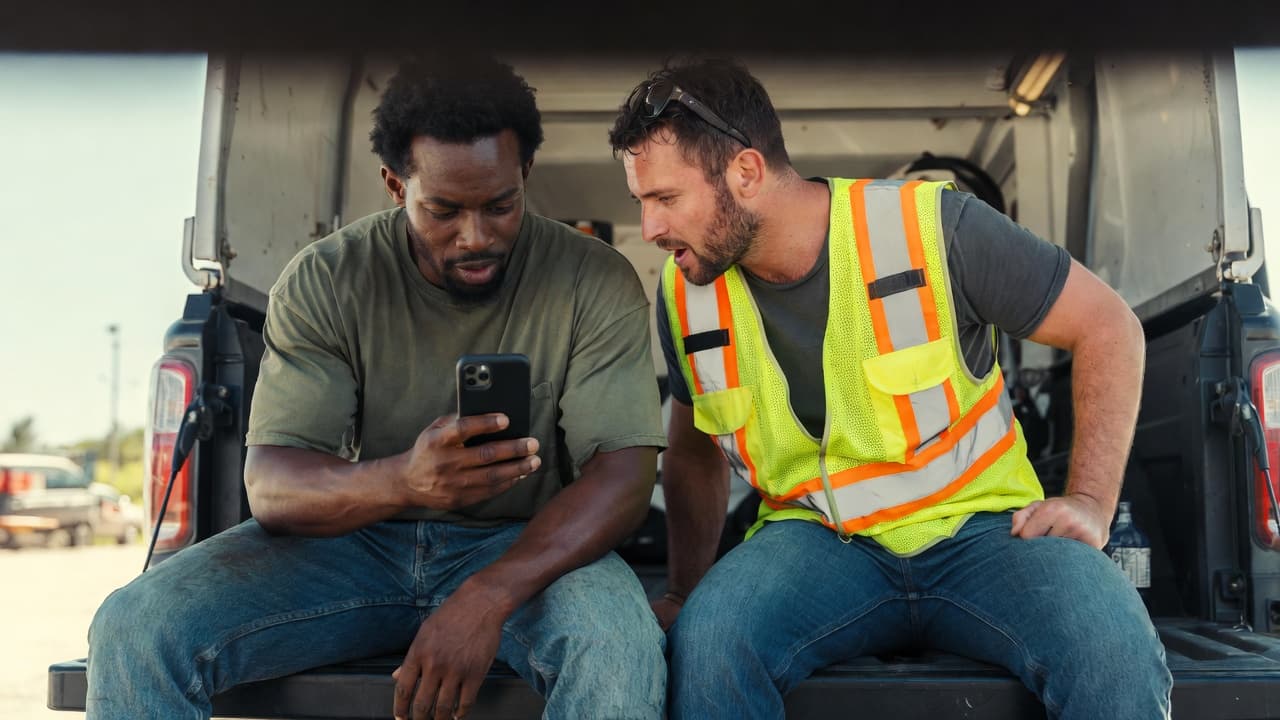 Woman with braids at a desk, focused on learning about investing on her laptop